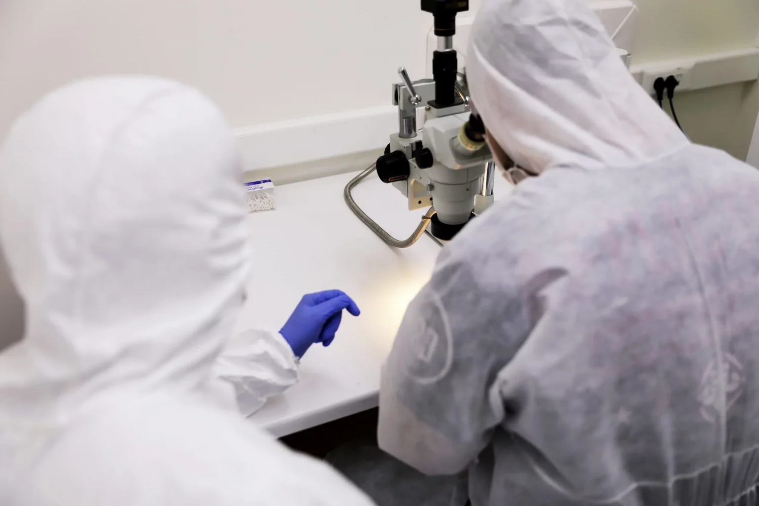 Technicians in full clean-room suits at PITS Data Recovery