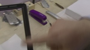 Good glass has a screen protector that is flush against the entire surface of the glass, applied at the factory at the time of production. You won't find dust, or any other junk under this protector.